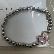 Carregar imagem no visualizador da galeria, Bow Stretch Bracelet in Carved Mother-of-Pearl, Reversible, Fashion Jewelry Gift Idea
